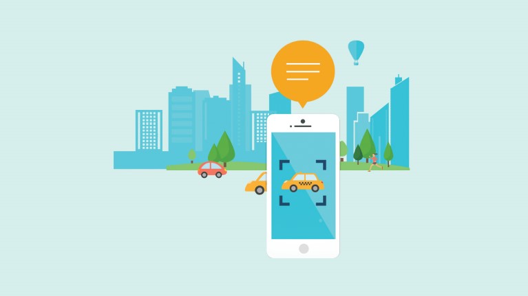 Vector graphic image via Microsoft website of a mobile phone camera being used to read aloud that there is a taxi on the street