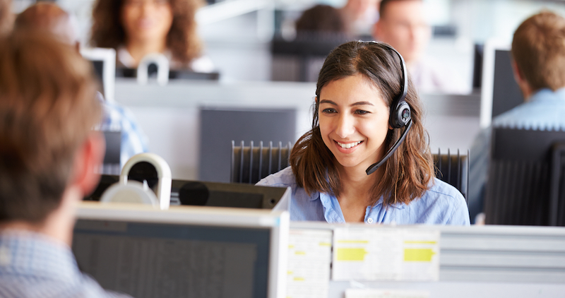 woman in call centre with bluetooth headset