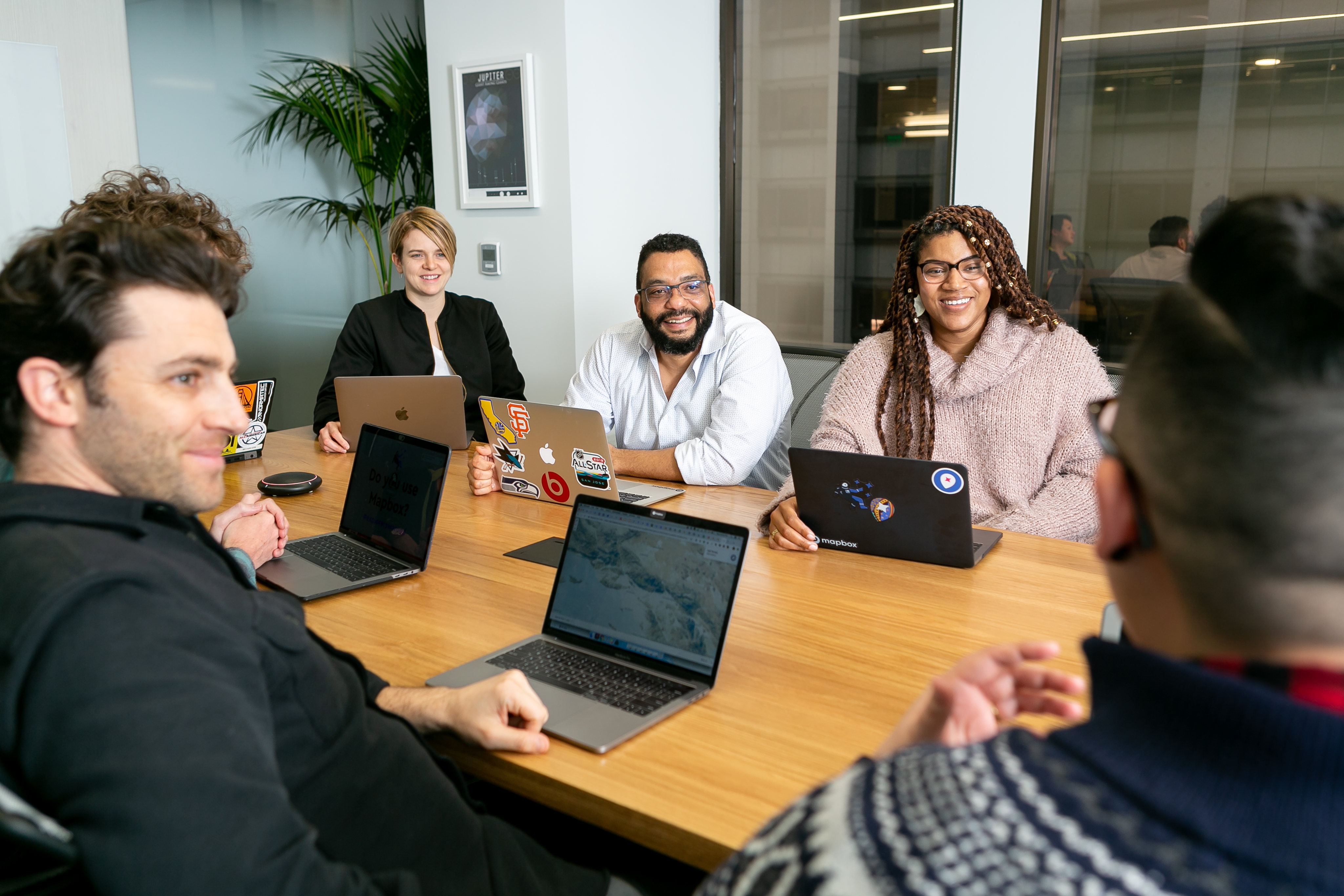 group of smiling people in a meeting