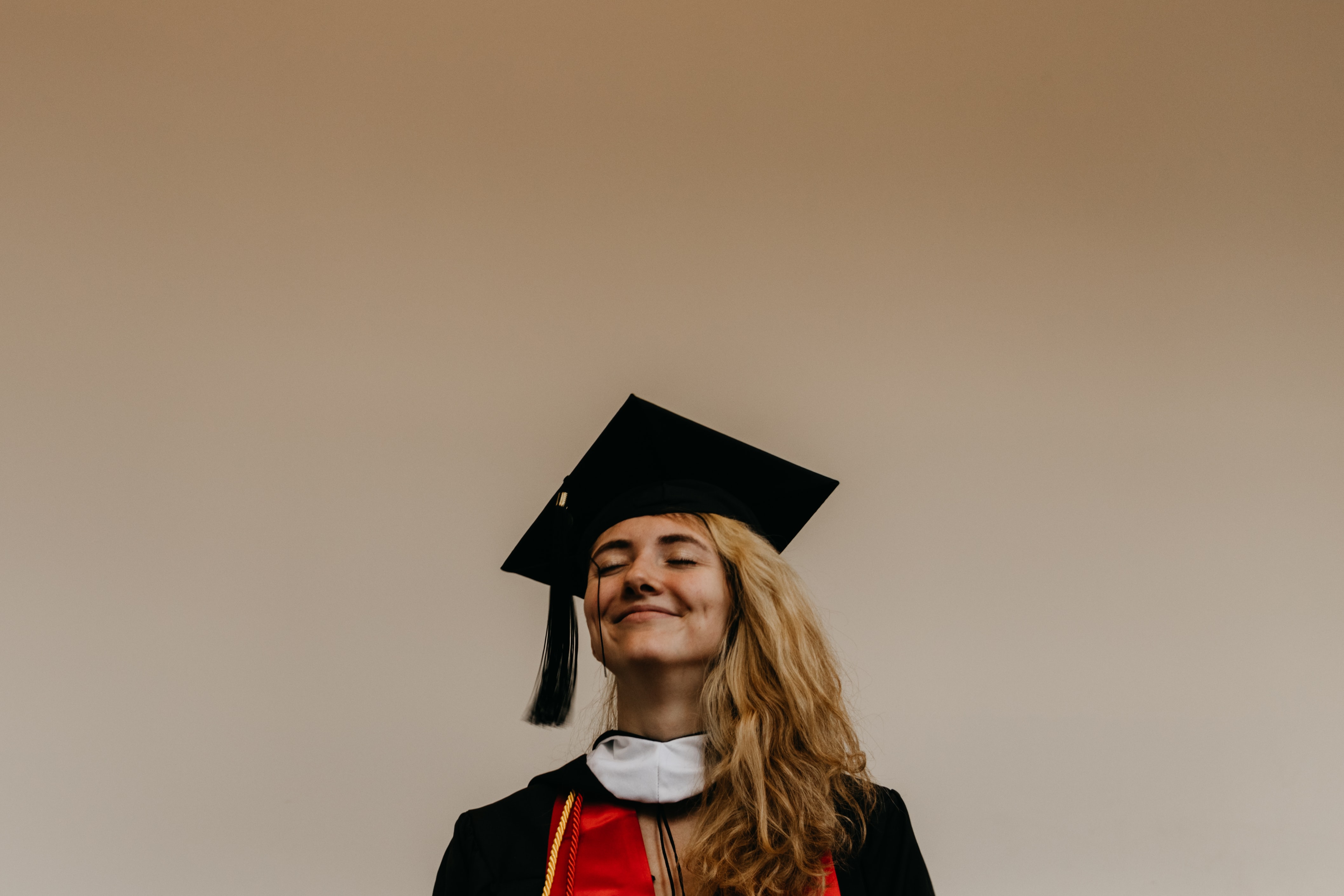 woman in graduation robes and hat