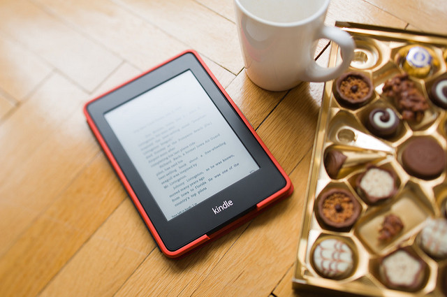 Amazon Kindle with coffee cup and chocolates