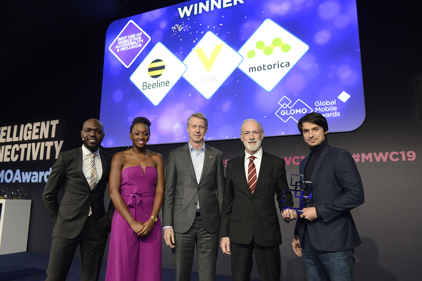 Photo of the Beeline and Motorica team accepting their award at the GLOMO Awards