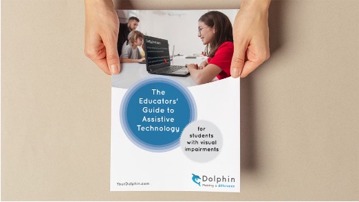 Hands holding a Dolphin 'The Educators' Guide to Assistive technology' booklet