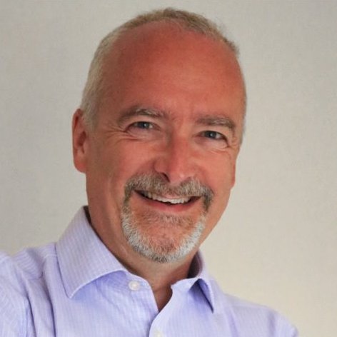 Profile photo of Gary Moore, AbilityNet's CEO, smiling facing the camera