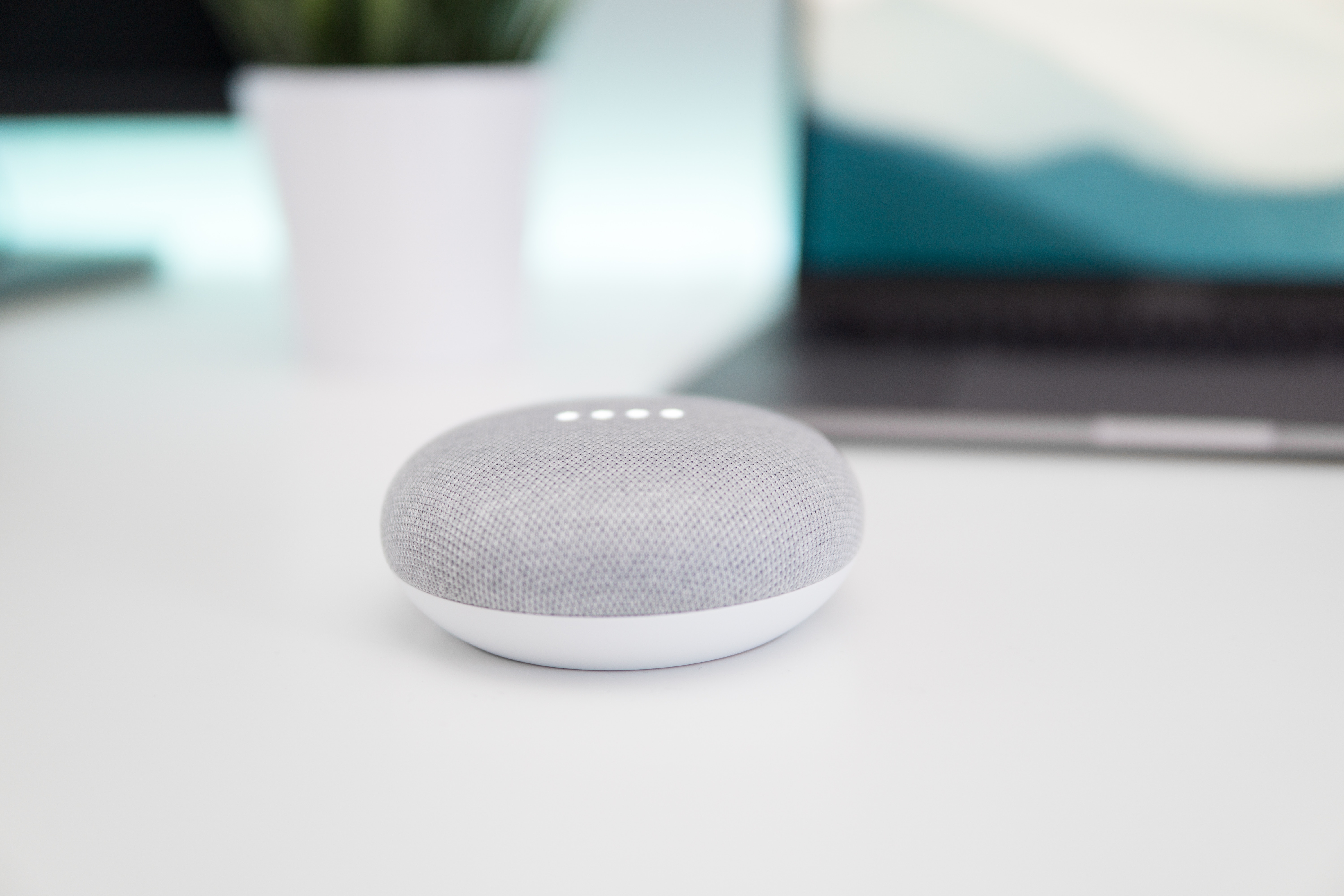 The google smart speaker with four lights on top
