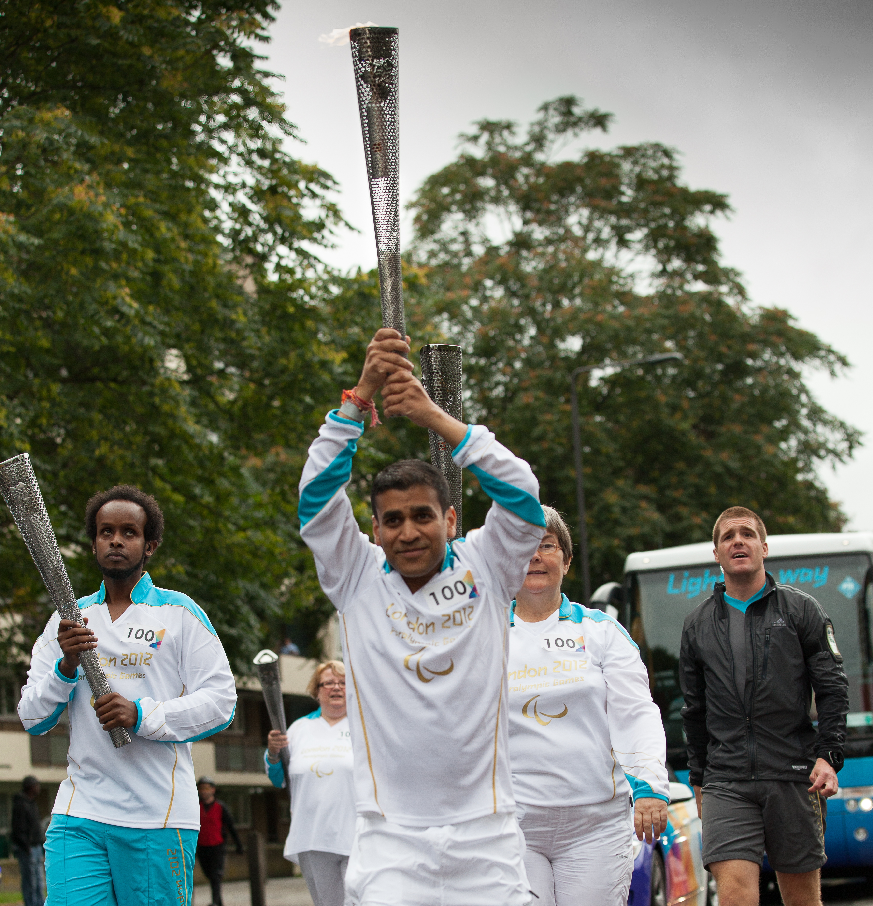 Trustee Kush pictured carrying the olympic torch