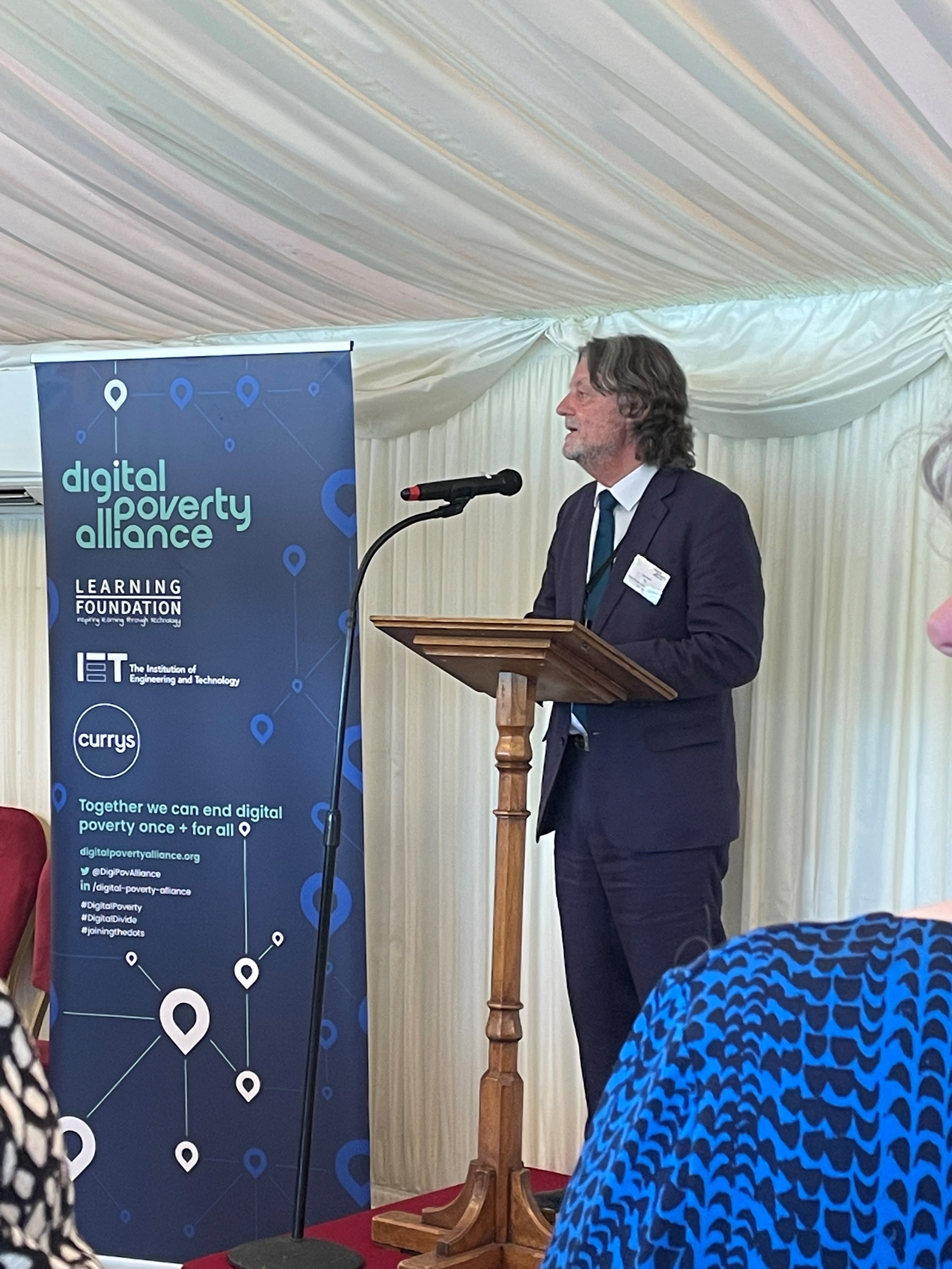 Paul Finnis, CEO of DPA, speaking into a microphone 