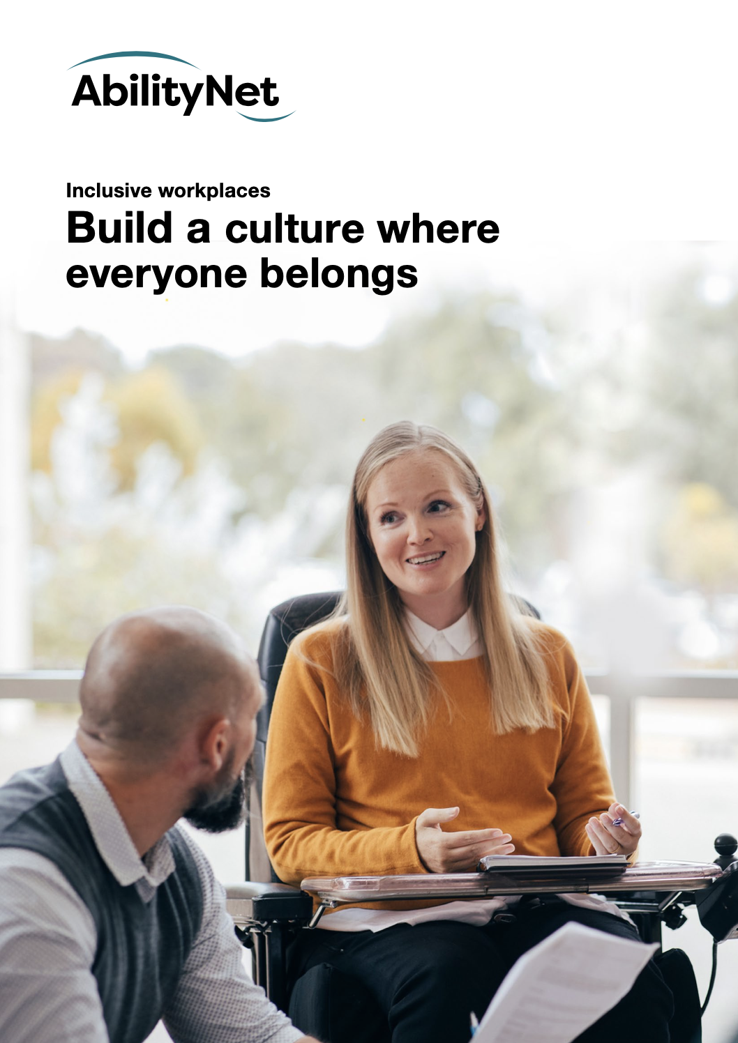 Front cover of downloadable document - featuring woman in a wheelchair on front, speaking to another person. Text reads: AbilityNet - Inclusive workplaces: Build a culture where everyone belongs