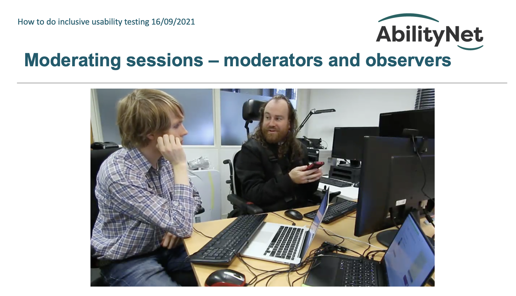 Screenshot of PPT presentation showing two men at a computer table and the words Moderating sessions - Moderators and observers