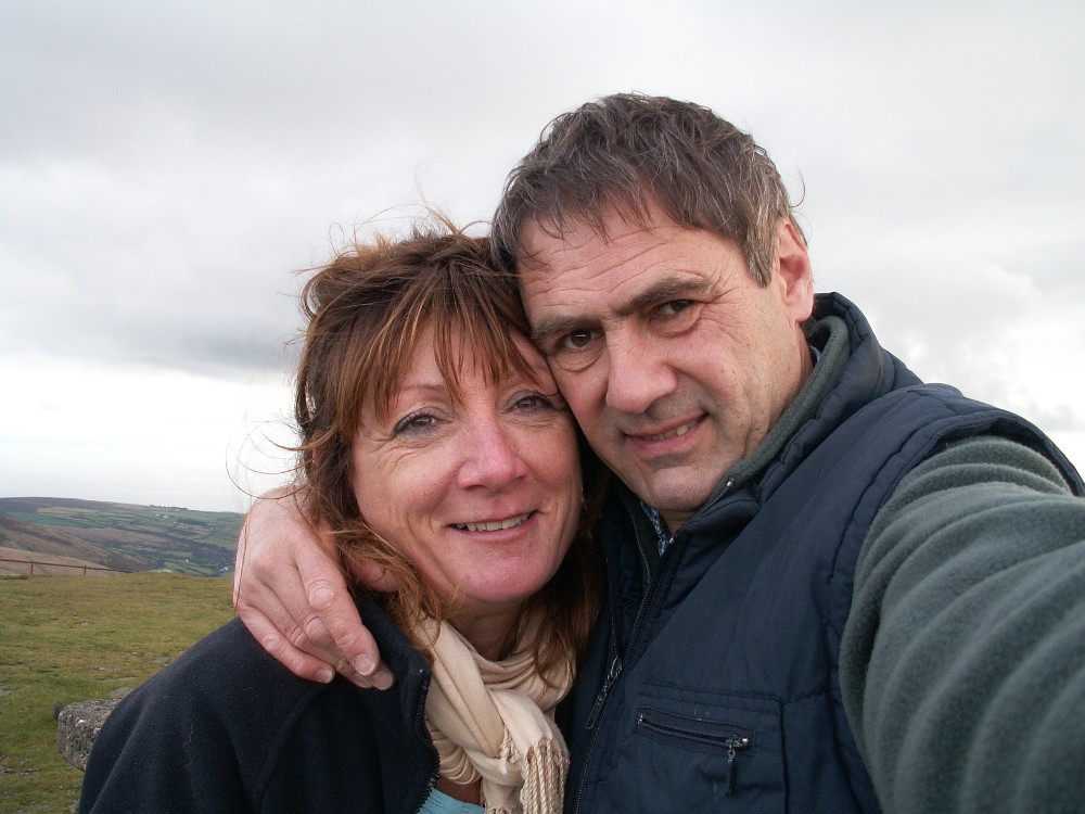 A couple Steven and Linda standing in the countryside