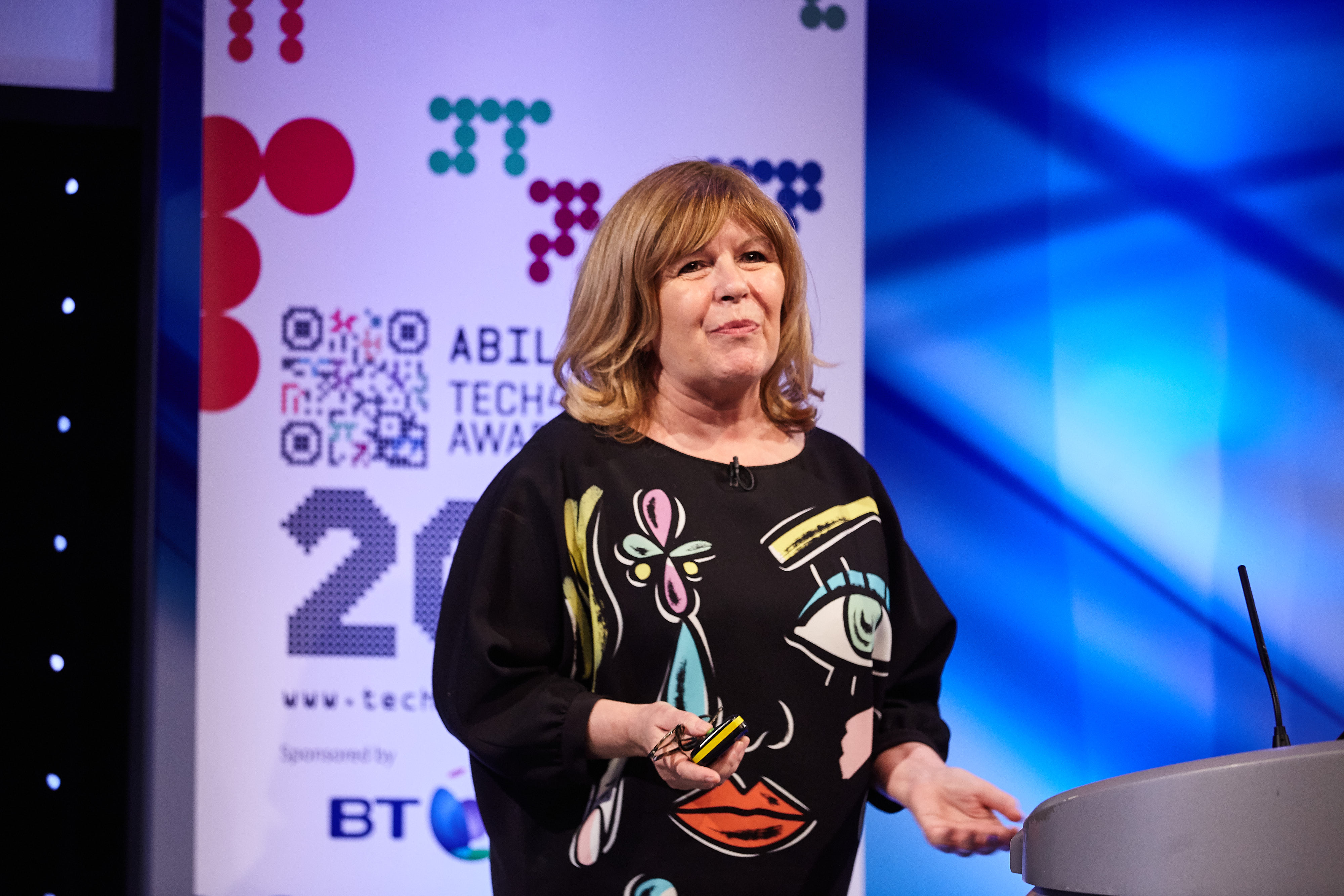 Photo of Maggie Philbin OBE getting the AbilityNet Tech4Good Awards Special Award 2017