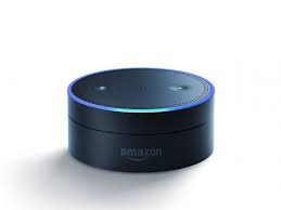 An Amazon Echo Dot, black on a white background