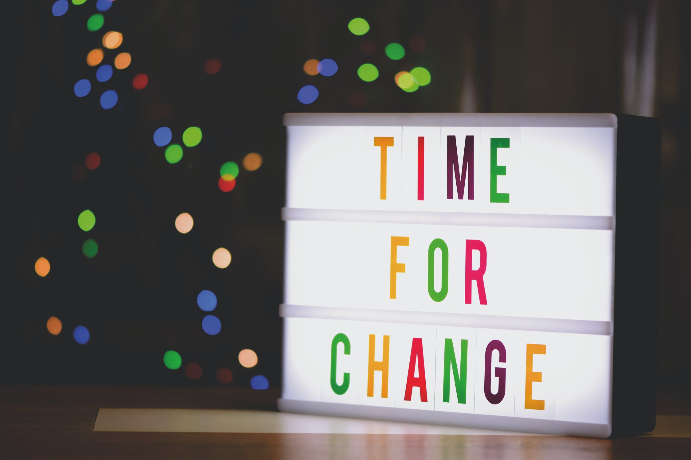 Image shows a light box with the writing "Time for Change"