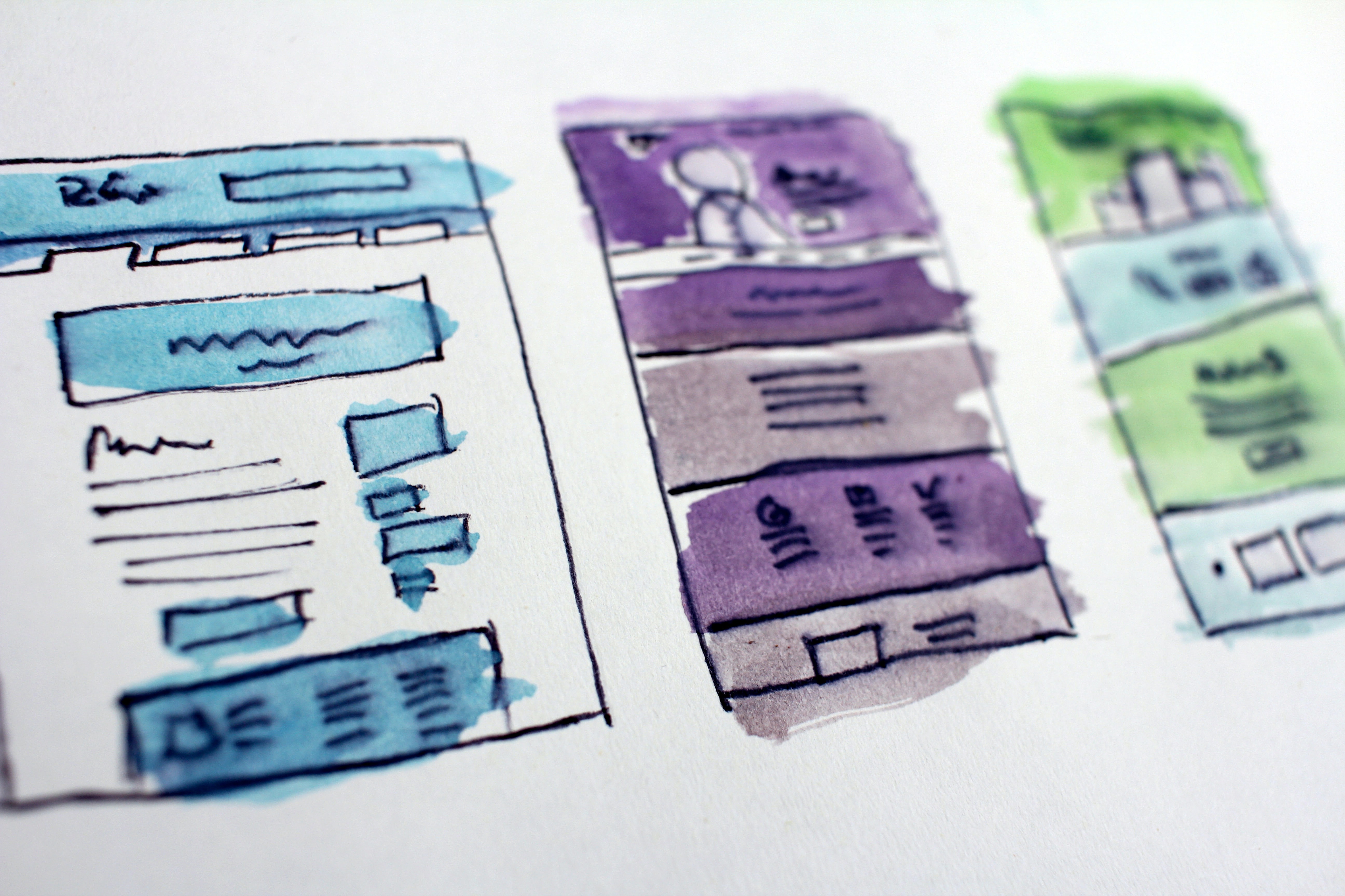 Image shows a sketch of a website, hand-drawn, with different coloured blocks