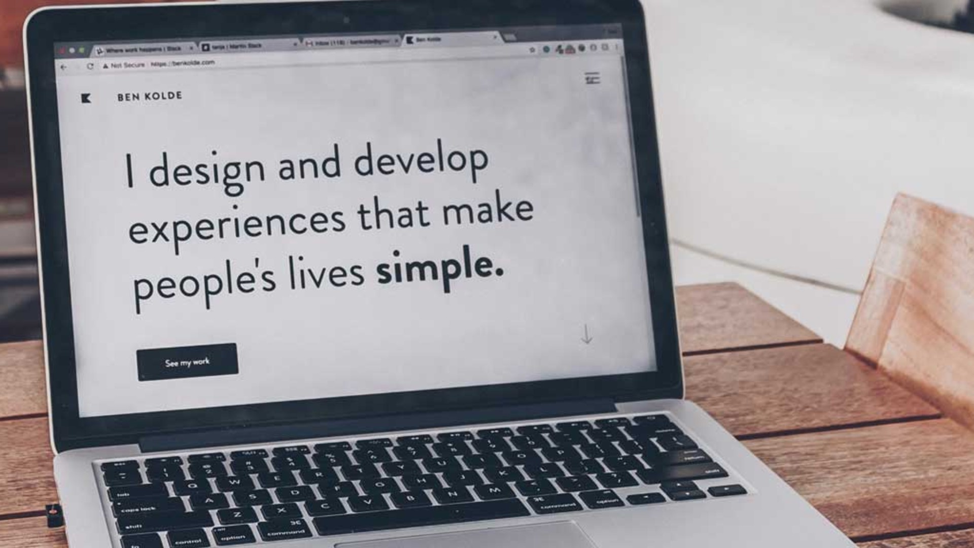 Laptop that reads I design and develop experiences that make people's lives simple.