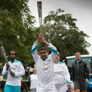 Kush Kanodia holding the paralympic torch
