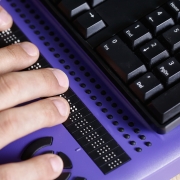 person using braille computer