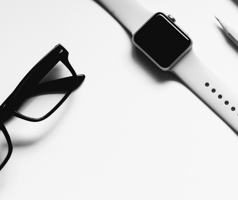 Glasses next to smart watch