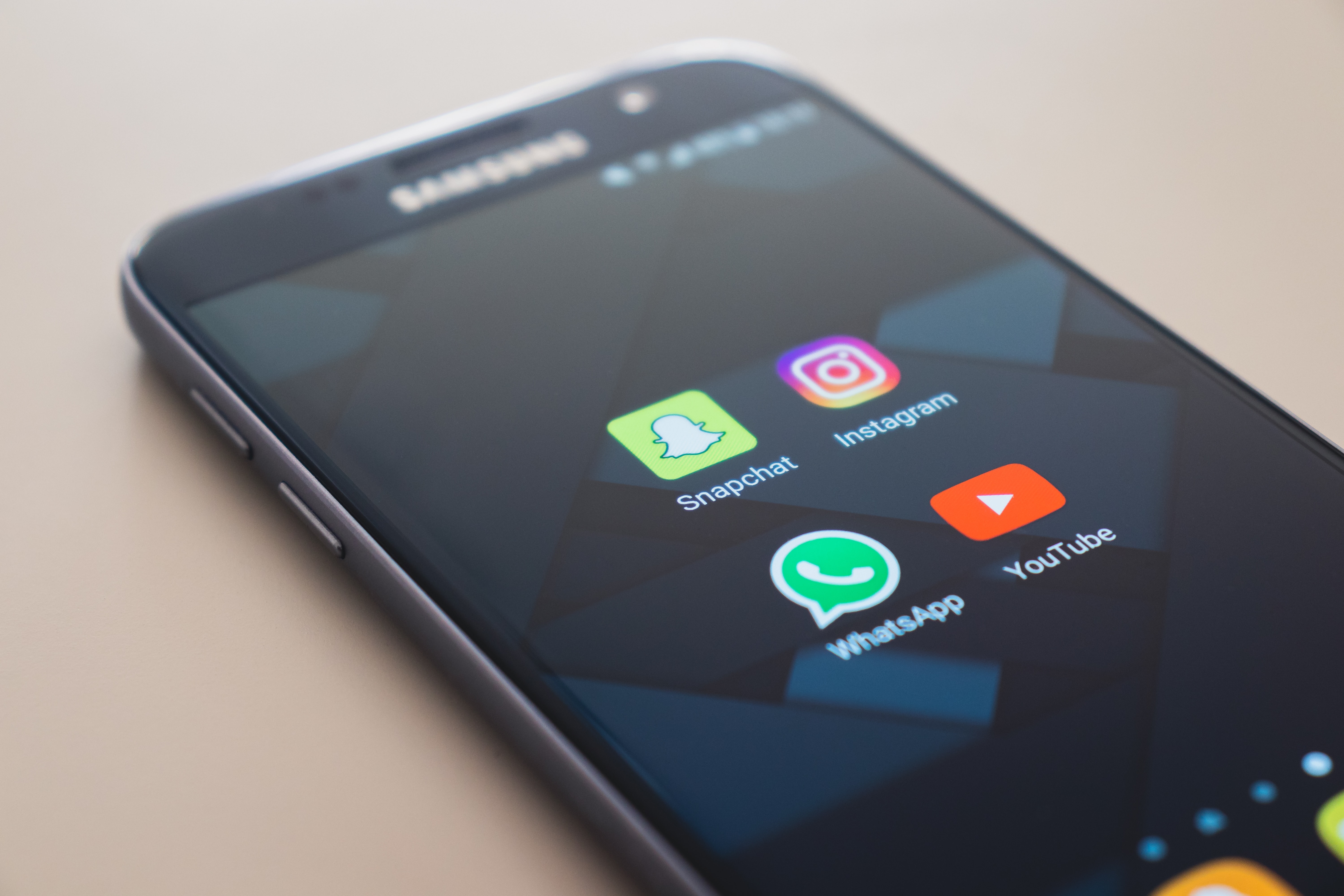 Picture of a Samsung phone with icons including WhatsApp