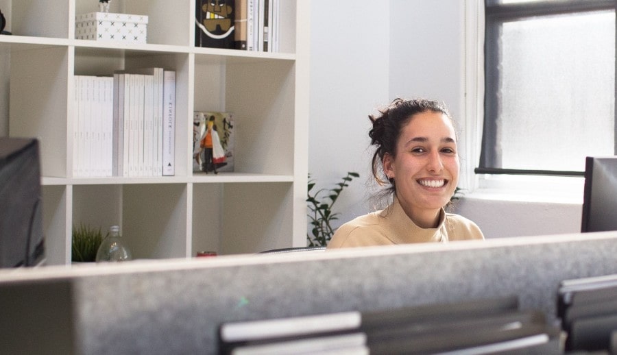 Woman in office environment smiling